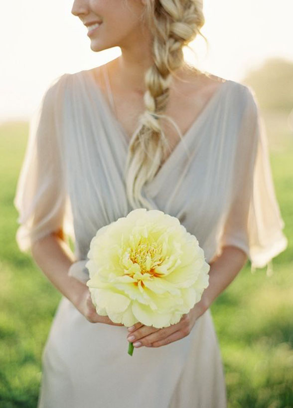 bridesmaid holding single flower